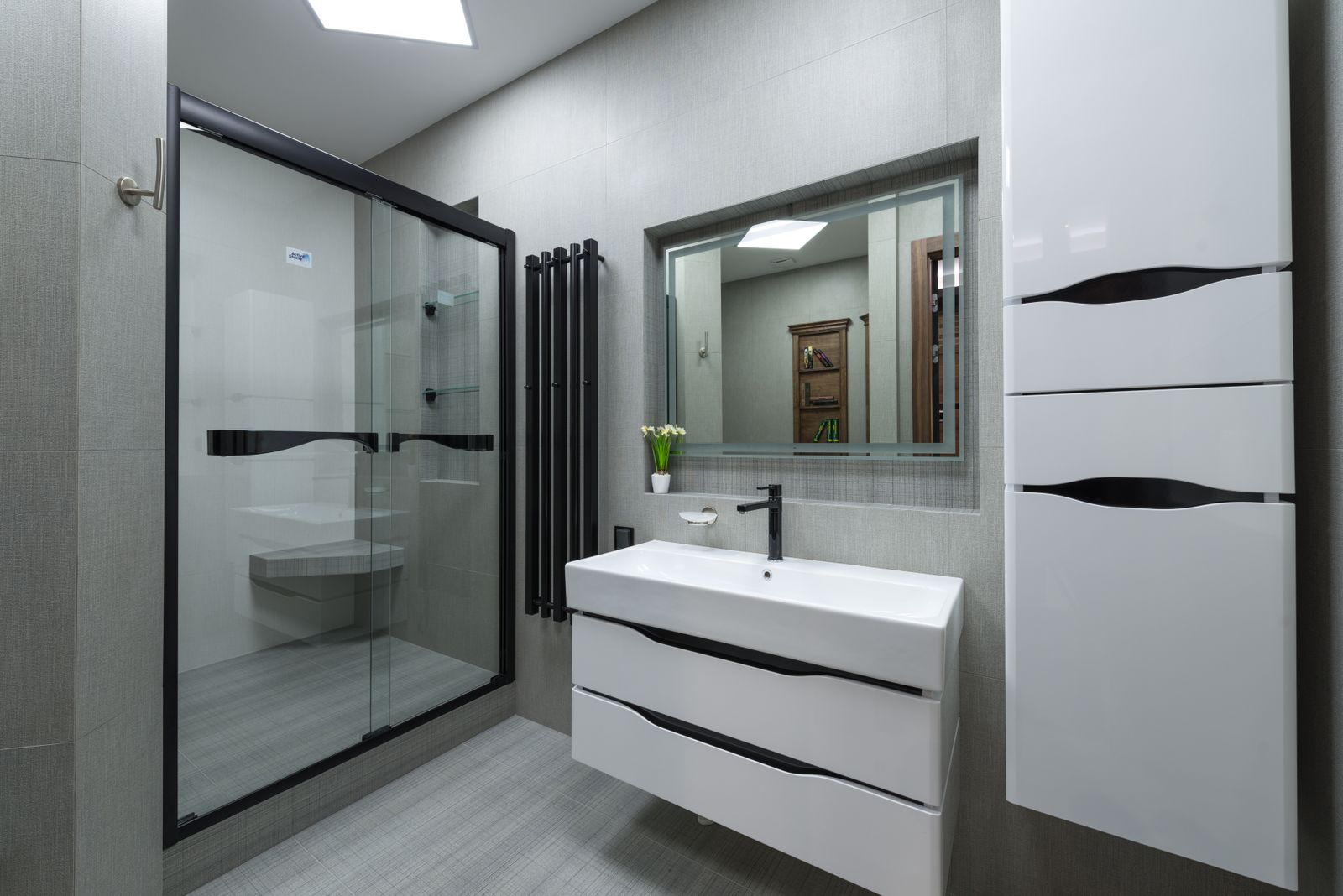 A newly fitted walk-in shower in a modern bathroom